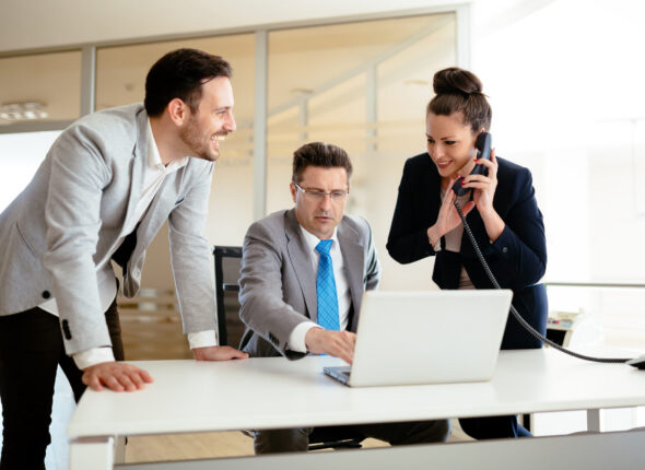 Secretaries assisting boss at business